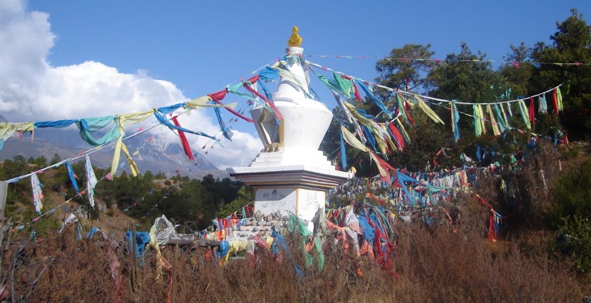 Buddhist Stupa and Prayer Flags in Dongba Cultural Village