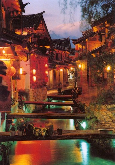 Canal in Lijiang Old City illuminated at night