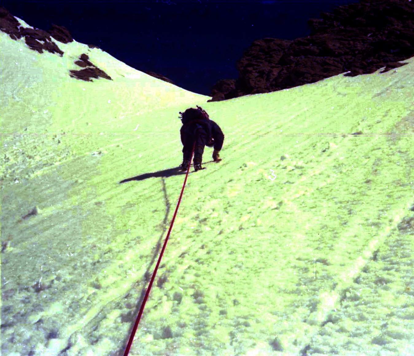 Climbing snow slopes to the Schrecksattel on the ascent of the Schreckhorn in the Bernese Oberland of Switzerland