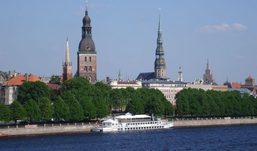 Spires of the Dom Cathedral and St.Peter's Church above the Daugava River in Riga - capital city of Latvia
