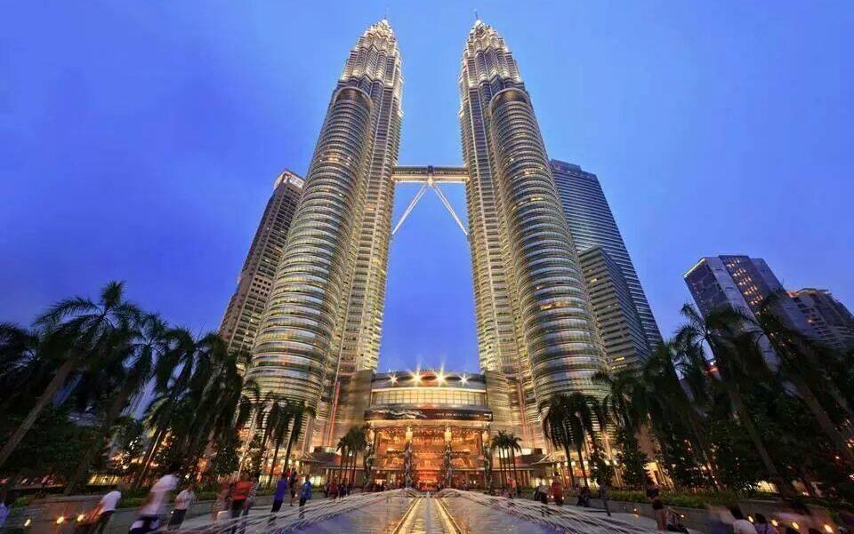 Petronas Towers illuminated at night in Kuala Lumpur