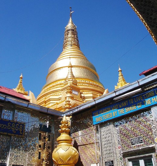 Golden Chedi on temple on top of Mandalay Hill in northern Myanmar / Burma