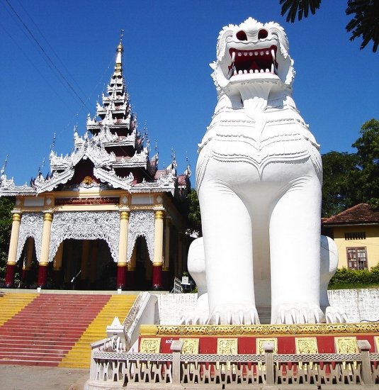 Giant Dragon Dog guarding entrance to temple on Mandalay Hill in northern Myanmar / Burma
