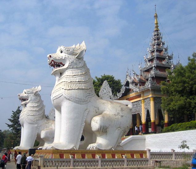 Giant Dragon Dogs guarding entrance to temple on Mandalay Hill in northern Myanmar / Burma