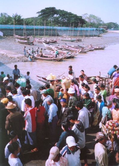 Disembarking from ferry at Dalah on Yangon River in Yangon ( Rangoon ) in Myanmar ( Burma )
