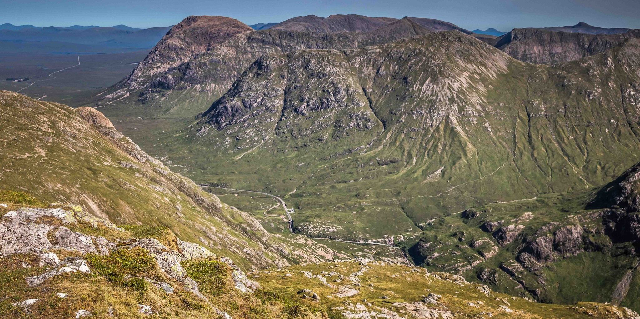 Buachaille Etive Mor and Buachaille Etive Beag from Aonach Eagach Ridge in Glencoe in the Highlands of Scotland