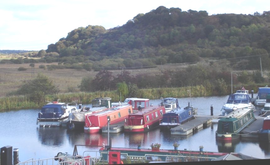 Boats in Auchinstarry Basin on Forth & Clyde Canal beneath Croy Hill at Kilsyth
