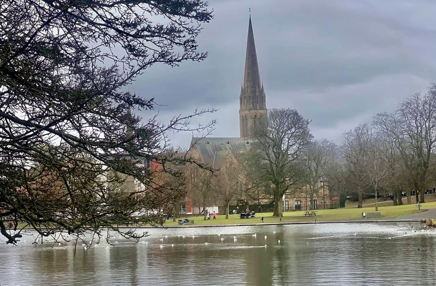 Boating pond and Queen's Park Baptist Church