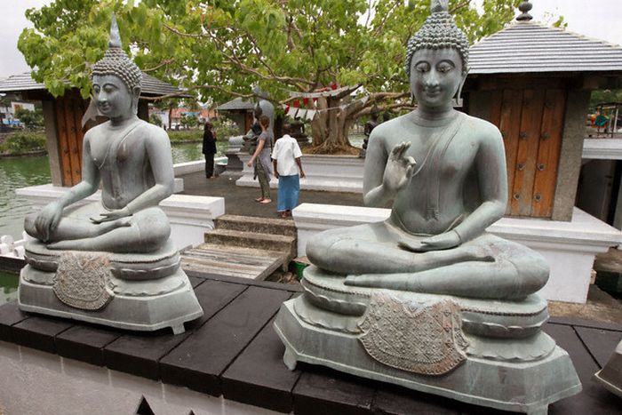 Buddha Statues at Seema Malakaya Temple on Slave Island in Berya Lake in Colombo - capital city of Sri Lanka