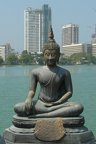 Buddha Statue at Seema Malakaya Temple on Slave Island in Berya Lake in Colombo - capital city of Sri Lanka