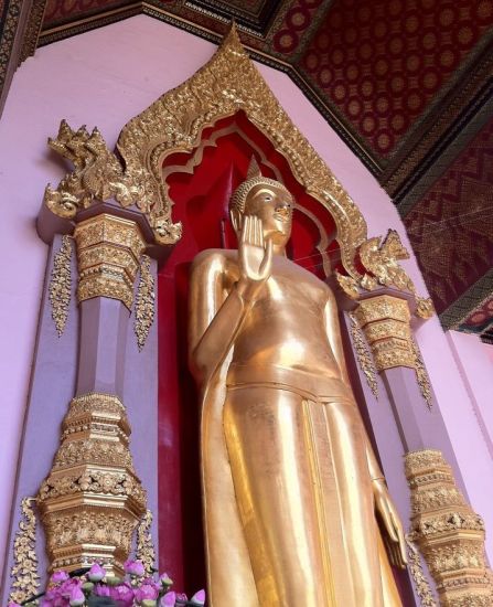 Standing Buddha statue in Wat Rachprakongtham in Nonthaburi