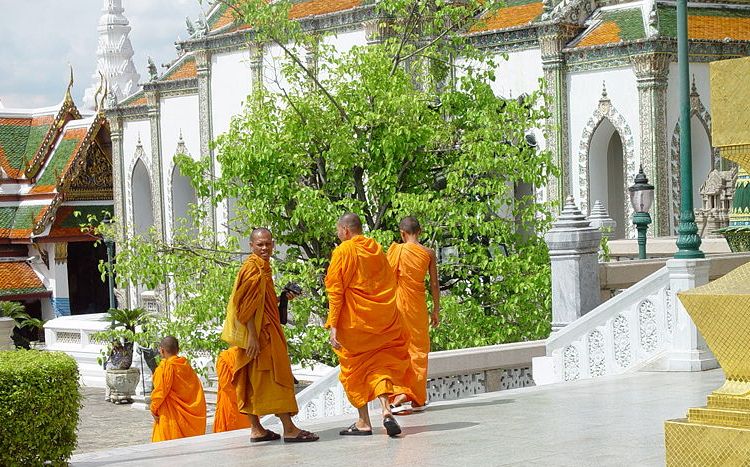 Buddhist monks in Wat Phra Kaew ( Temple of the Emerald Buddha ) in Bangkok
