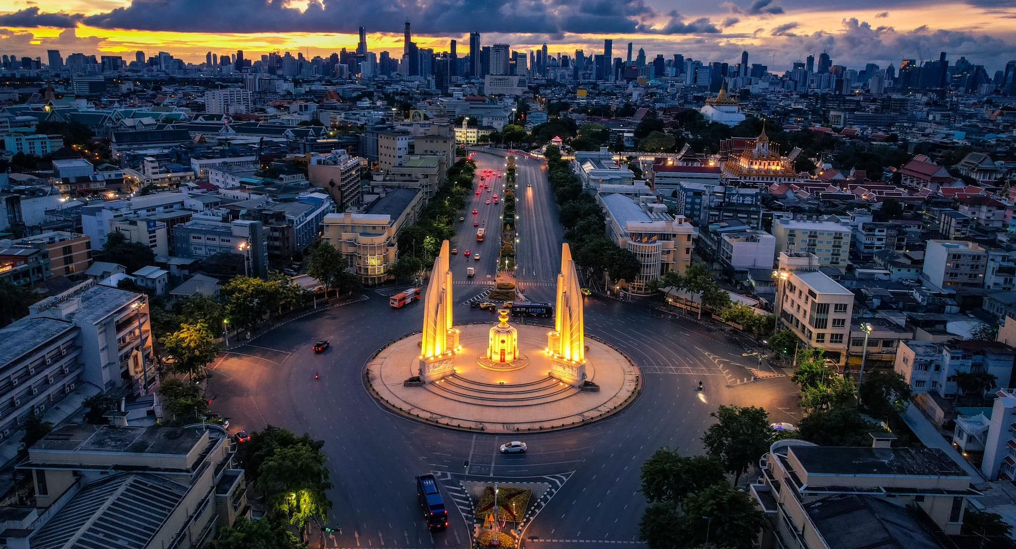 Democracy Monument illuminated at night in Bangkok