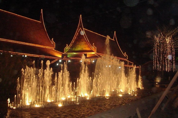 Traditional-style Buildings illuminated at night in Phitsanulok in Northern Thailand