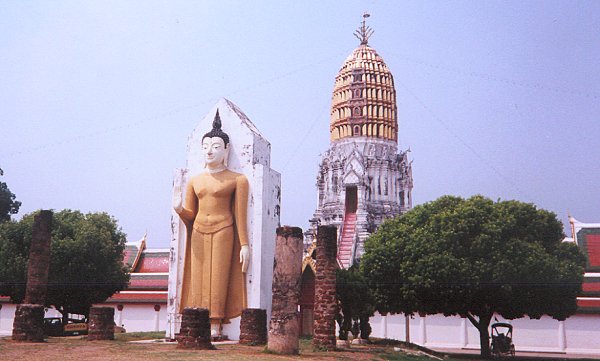 Standing Buddha and Chedi at Wat Phra Si Rattana Mahathat in Phitsanulok in Northern Thailand