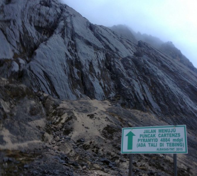 Sign on Carstensz Pyramid ( Puncak Jaya ) - highest mountain in Indonesia and Oceania / Australasia