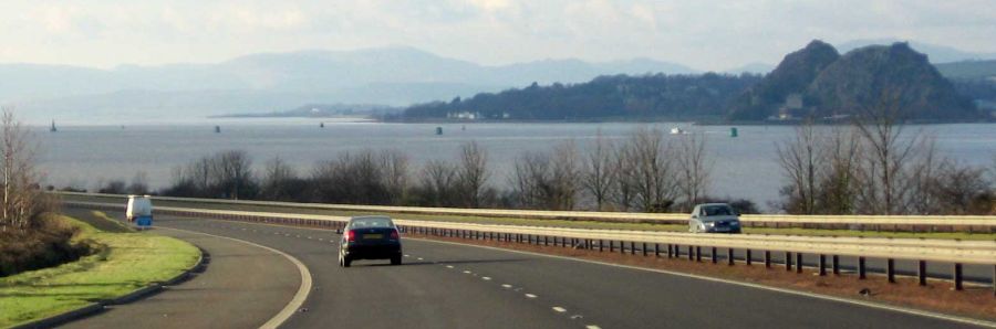Dumbarton Rock across River Clyde from M8 motorway